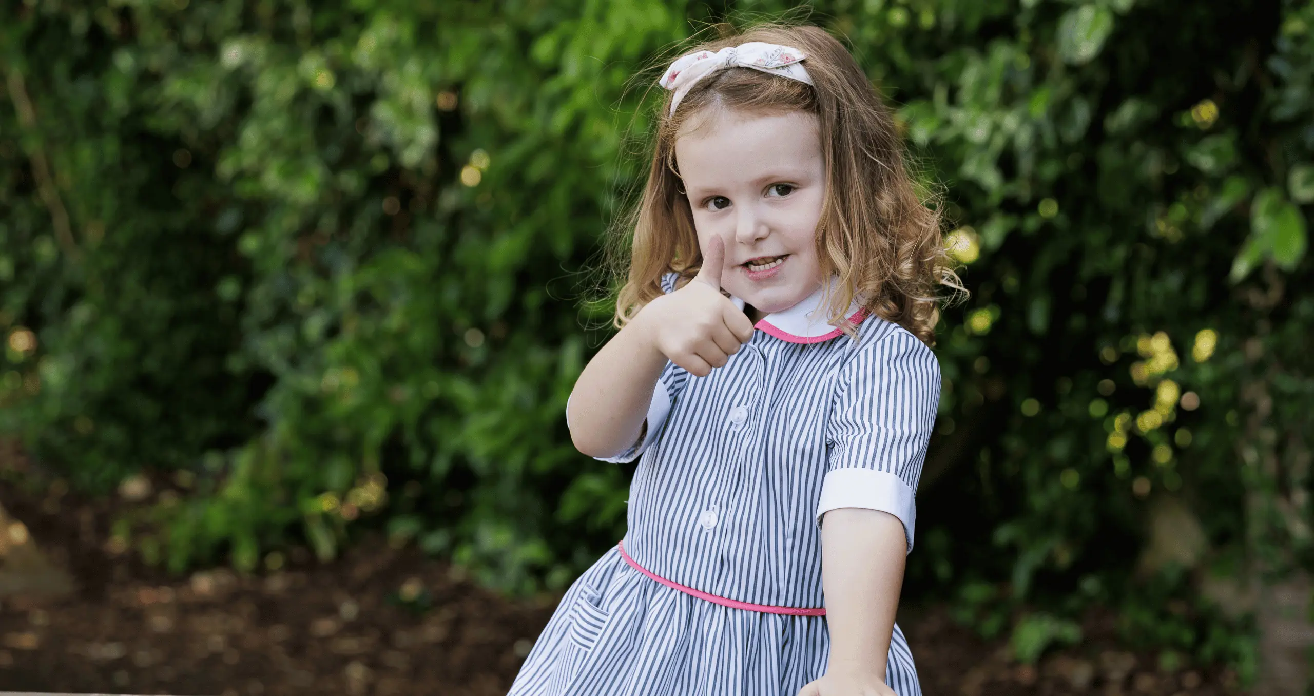 Girl playing at forest school