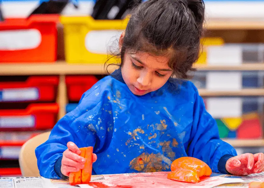 girl in art lesson painting