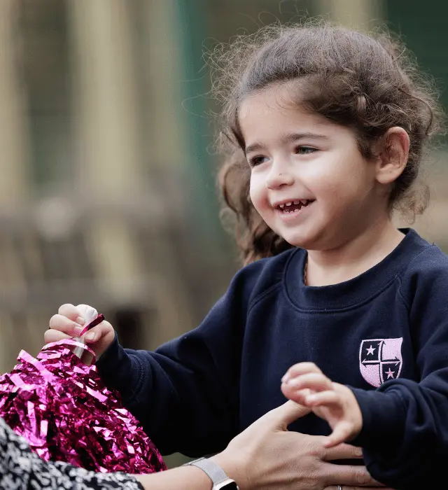 girl running to teacher with open arms