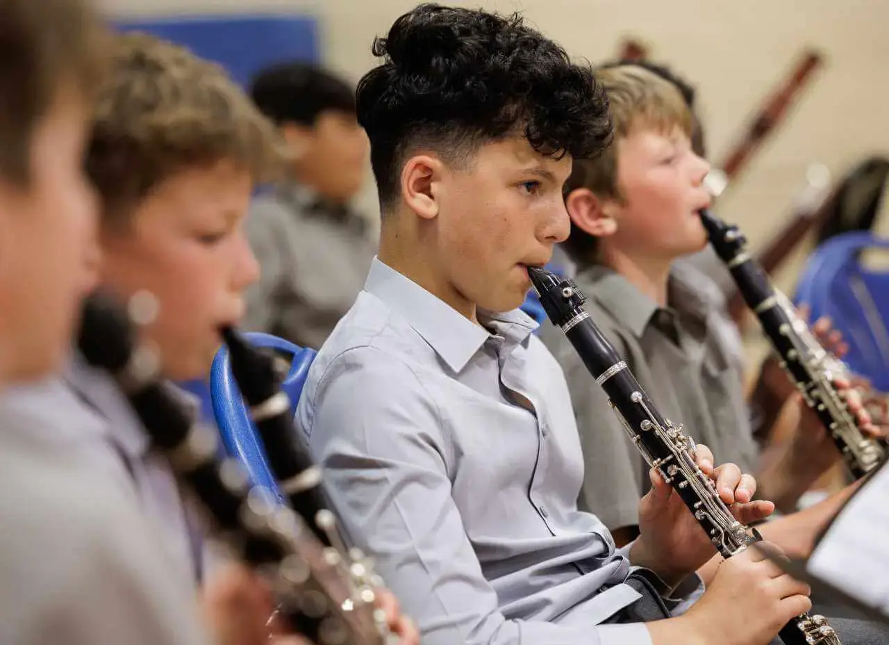 pupils in music lesson playing the clarinetContent Image